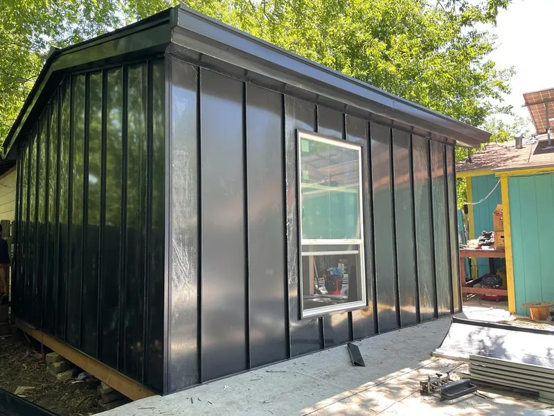 Black standing seam metal wall panels for Roof Inspection in Stickney